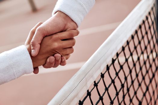 Man and woman are shaking hands with wristbands on it