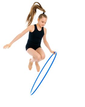 A girl gymnast performs an exercise with a hoop. The concept of gymnastics and fitness. Isolated on white background.