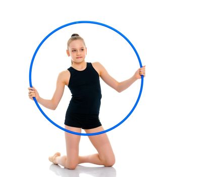 A girl gymnast performs an exercise with a hoop. The concept of gymnastics and fitness. Isolated on white background.