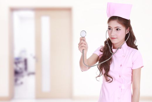 female nurse with stethoscope in hospital background