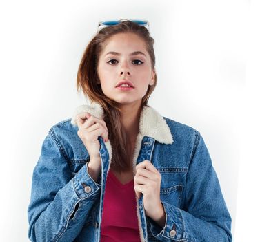 young pretty teenage hipster girl posing emotional happy smiling on white background, lifestyle people concept close up, wearing glasses close up