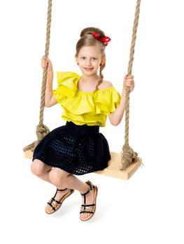 Happy little girl gaily swinging on a swing. The concept of a summer vacation in nature, a family vacation with the family on the beach or the sea. Isolated on white background.