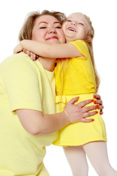 Mom and little daughter plus the size of the model, gently embrace. A woman and her daughter are smiling in a happy manner. Good for the concept of health, happiness, diet, obesity, weight loss.