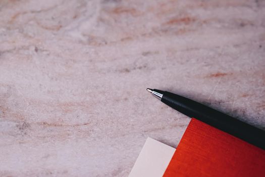 Pen and papers as office stationery, closeup