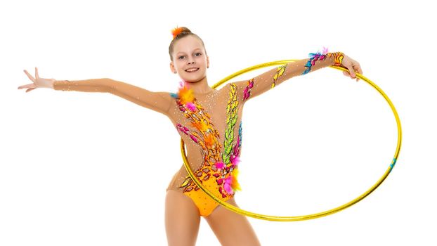 A girl gymnast performs an exercise with a hoop. The concept of gymnastics and fitness. Isolated on white background.