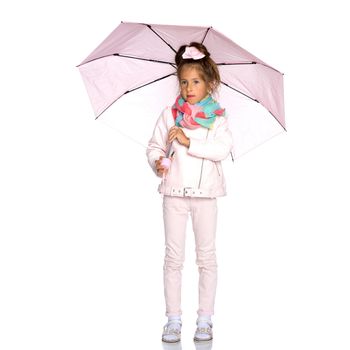 A nice little girl hid under an umbrella. The concept of a happy childhood, outdoor recreation, protection from bad weather. Isolated on white background.