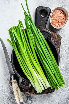 Raw Green onions chives. White background. Top view.