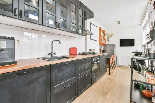 Pretty kitchen with black wood kitchen unit