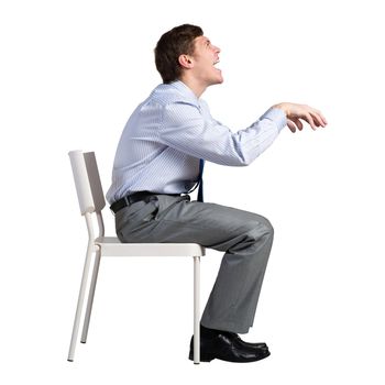 businessman sits on a chair, plays an imaginary piano