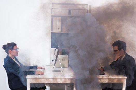 Close-up of fire burning inside the office cabin during works. Men and women office workers in a fire. Short circuit and incidents concept. SOS and save lives