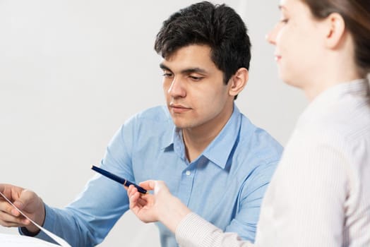 portrait of a young man at a business meeting. concept of team work