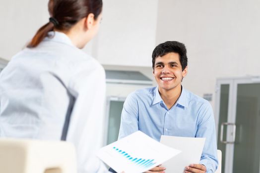 portrait of a young man at a business meeting. concept of team work