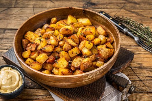 Fried potato - Patatas bravas traditional Spanish potatoes snack tapas. wooden background. Top view.