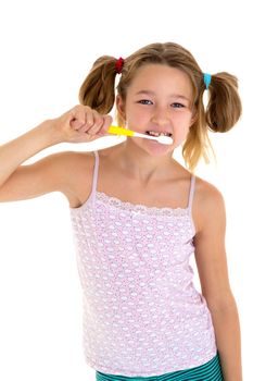 Smiling girl standing with toothbrush in her hands. Preteen girl brushing her teeth before or after sleeping. Cute child daily routine concept