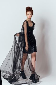 woman in black dress posing fashion glamor studio. High quality photo