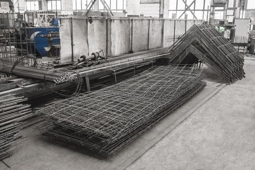 Reinforcement of concrete structures on plant. Armature storage materials in industrial workshop. Fitting manufacturing.