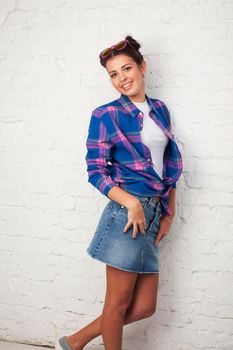 young pretty stylish hipster girl posing emotional isolated on white background happy smiling cool smile, lifestyle people concept close up