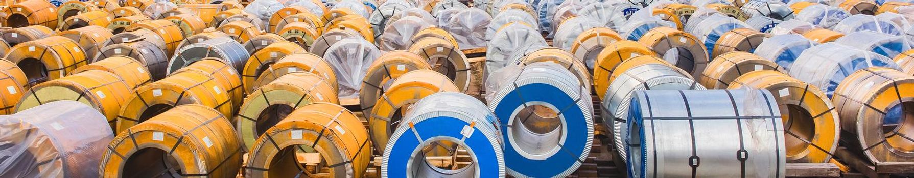 Industrial area, construction site with rusty metal packaging, steel manufacturing and storage, panoramic view, high resolution.