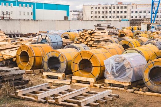 Industrial area, construction site with rusty metal packaging, manufacturing and steel storage.