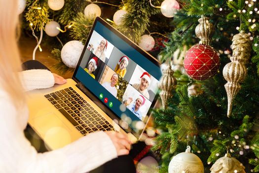 woman hands with computer, video call at christmas.