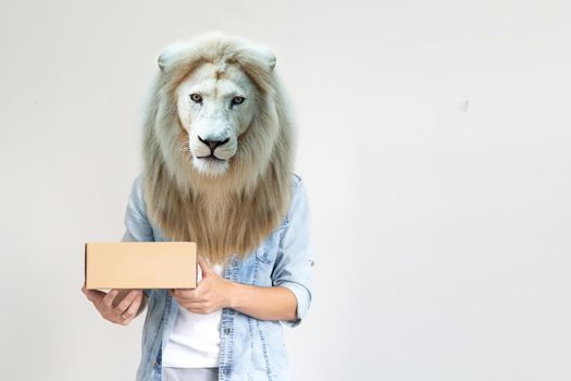man with head of lion holding delivery boxes on white background