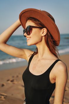 woman walking on the beach landscape sun fun lifestyle. High quality photo