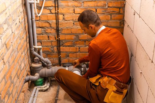 Technician servicing an hot-water heater.