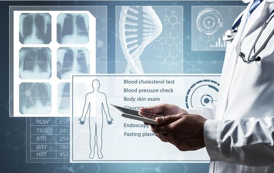 The doctor works with a computer tablet. Digital Medicine Concept