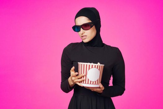 arab woman entertainment cinema popcorn fashion isolated background. High quality photo