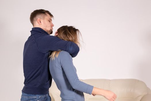 people, abuse and violence concept - agressive man strangling his wife.