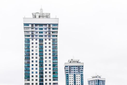 New modern high-rise apartment urban building exterior, facade of a residential city house.