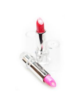 colored lipstick balm closeup isolated on white