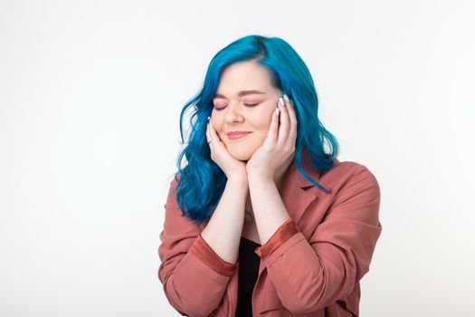 People, emotions and fashion concept - Beautiful girl with blue hair and joyful face on white background.