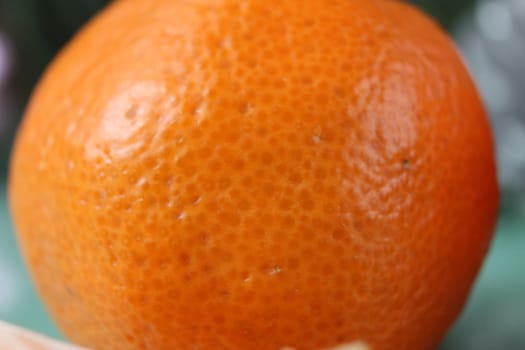 slice a piece of tangerine close-up. Orange citrus with white veins. food close-up.