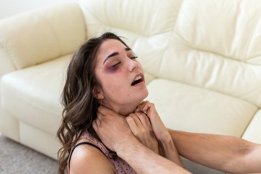 Victim, abuse and domestic violence - Woman being abused and strangled by strong man.