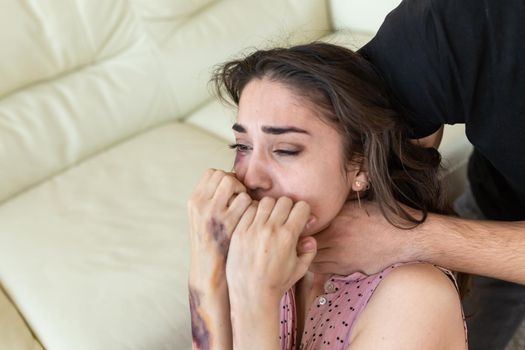 Victim, abuse and domestic violence - cruel man strangling his wife.