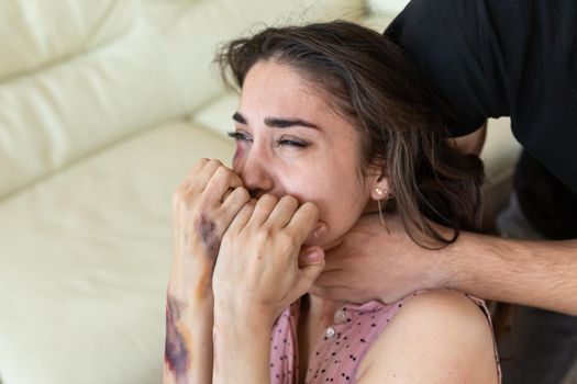 Victim, abuse and domestic violence - cruel man strangling his wife.