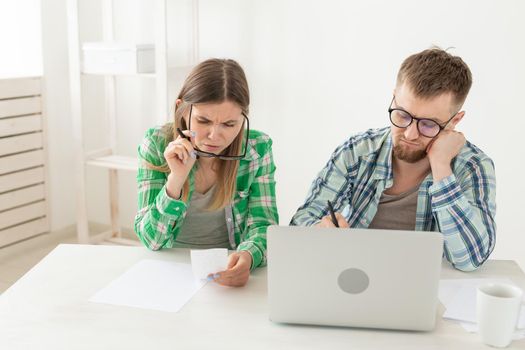 Upset husband and wife consider the total costs of payments and purchases made over the past month. The concept of low standard of living of students