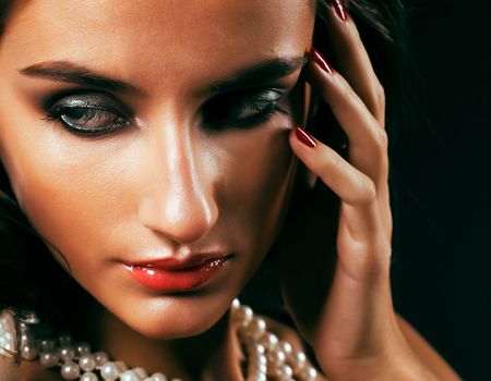 beauty rich woman with bright makeup wearing luxury jewellery on black background, fashion lady close up