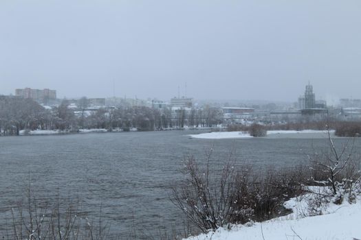 winter landscape. River lake without ice swamp plants neg. winter entertainment. Plants in the snow.