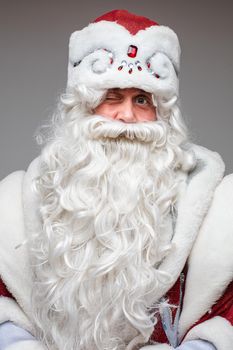 portrait of winking father frost, picture isolated on grey background