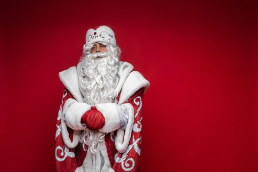 father frost with long white beard , picture isolated on red background