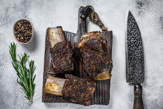 Barbecue short chuck beef ribs with herbs. White background. Top view.