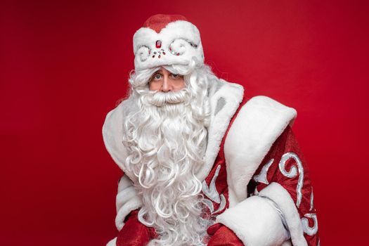 santa claus with long white beard, picture isolated on red background