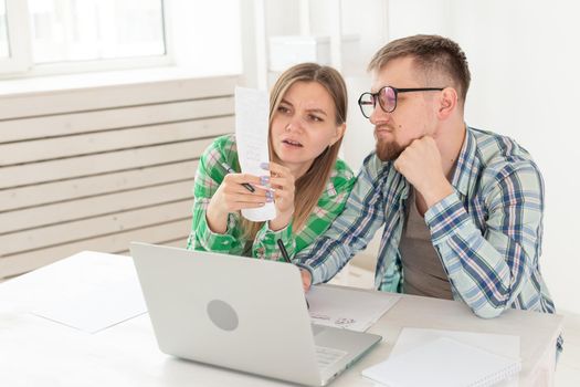 Upset husband and wife consider the total costs of payments and purchases made over the past month. The concept of low standard of living of students