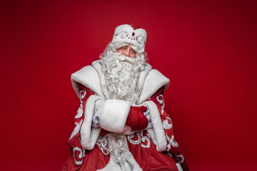 santa claus with long white beard, picture isolated on red background