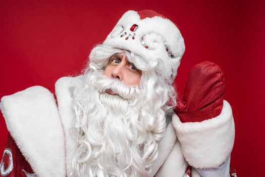 portrait of winking father frost, picture isolated on grey background