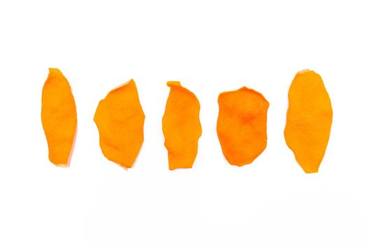 Dried orange peels isolated on a white background.