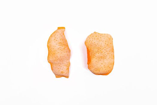 2 Dried orange peels isolated on a white background, close-up.