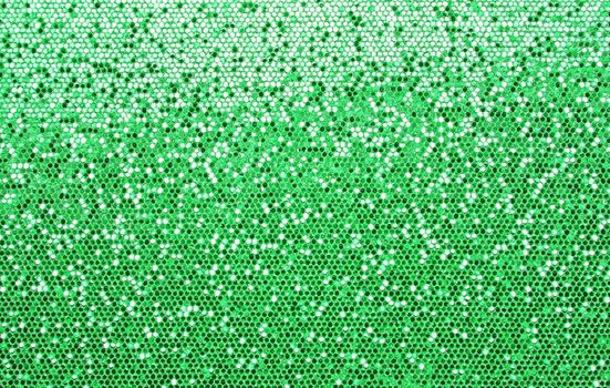 Abstract background texture of shiny green glitter pattern light gradient